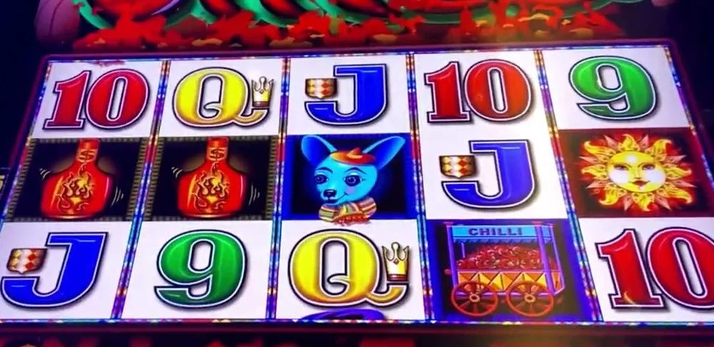 More Chilli pokie base game reels by Aristocrat